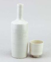 ANDY SHORE; a tall translucent porcelain sake bottle, incised AS marks, height 25cm, and a