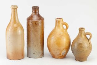 An unnamed 18th century salt glazed spirit bottle, height 27cm, two German bellarmine type jugs, and