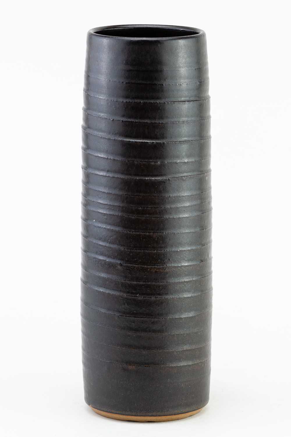 † JOHN SOLLY (1928-2004); a tall cylindrical stoneware vase with pronounced ribbing covered in