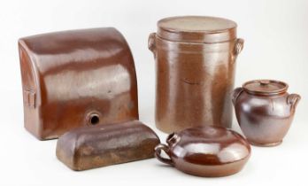 A collection of 19th century salt glazed pieces including a saddle shaped foot warmer, length