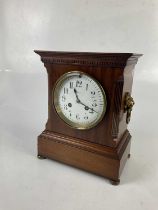 An early 20th century French mahogany mantel clock, the enamel dial set with Arabic numerals