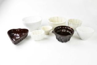 A collection of vintage ironstone and ceramic jelly moulds.