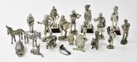 A collection of silver plated figures and animals, including various soldiers, a butcher, figures
