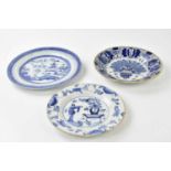 DELFT; two 18th century tin glazed plates to include an example in the Oriental manner with a figure