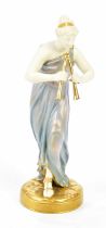 ROYAL WORCESTER; a blush ivory figure of maiden playing pipes, height 20cm. Condition Report: Chip