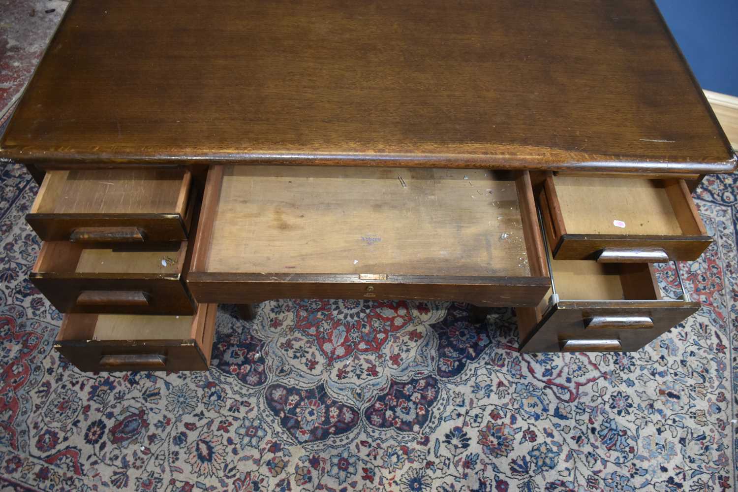 ABBESS; an oak knee-hole desk, with an arrangement of seven drawers, on rounded square legs, - Image 5 of 6