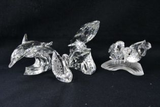 SWAROVSKI; four crystal models including swan, dolphins, annual edition, turtle doves etc. Condition