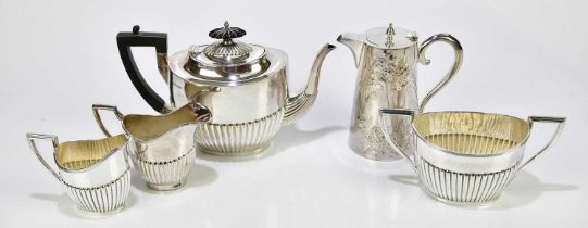 WALKER & HALL; a silver plated three piece tea service with gadrooned decoration, a similar jug