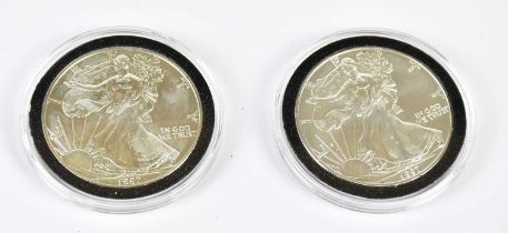 Two cased 1997 silver dollars.