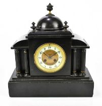 A Victorian slate mantel clock with three finials and dome top above the dial set with Arabic