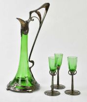 AFTER WMF; an Art Nouveau style silver plated and green glass four piece drinking set comprising