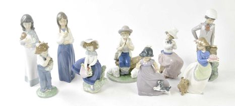 LLADRO; a figure of a girl holding a basket of flowers, height 18cm, and eight Nao figures (9).