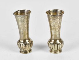 A pair of Edward VII hallmarked silver posy vases with gadrooned lower bodies, London 1908, (