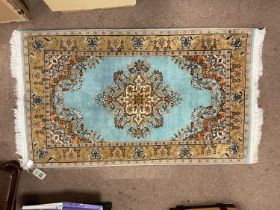 A blue ground Ladik wool and cotton rug, 92 x 157cm.
