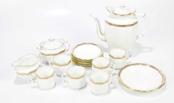 ROYAL CROWN DERBY; a "Carlton red"coffee service, to include six saucers, six cups, sugar bowl,