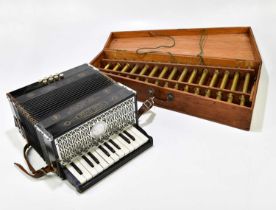 A brass Turkish tubephone, 60cm, cased and a Pine Tree Brand Ludwig accordion (2).