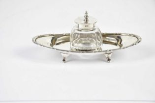 MAPPIN & WEBB; an Edwardian hallmarked silver ink stand of oval form, with silver mounted glass