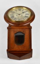 A late 19th century oak cased drop dial wall clock, with silvered dial set with Roman numerals,