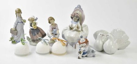 LLADRO; a group of six figures to include young girl feeding puppy, young girl playing with a