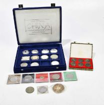 A collection of assorted coinage including American Morgan dollar, an Elizabeth II crown,