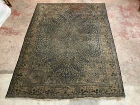 A blue ground Eastern style rug with floral decoration, 355 x 260cm