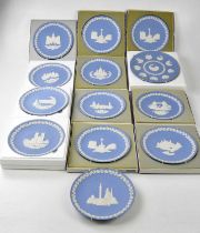 WEDGWOOD; a collection of thirteen jasperware Christmas plates, some boxed.