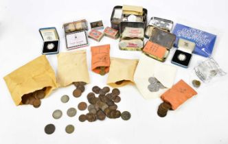 A collection of British and foreign coins to include silver crowns, shillings, commemorative