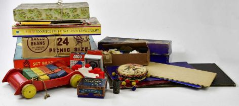 A large quantity of assorted vintage toys including various board games, Criss Cross, Solitaire,