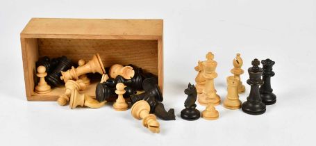 A full set of wooden chess pieces, boxed.