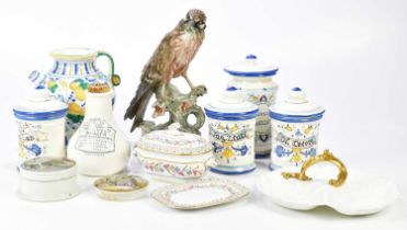 An assortment of ceramics including reproduction faience, pharmaceutical ceramic jars, similar ewer,