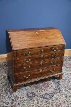 A 19th century mahogany bureau, the fall front enclosing fitted interior above four long drawers,