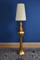 A large modern decorative gilt standard lamp with central orb, height including fitting 124cm.