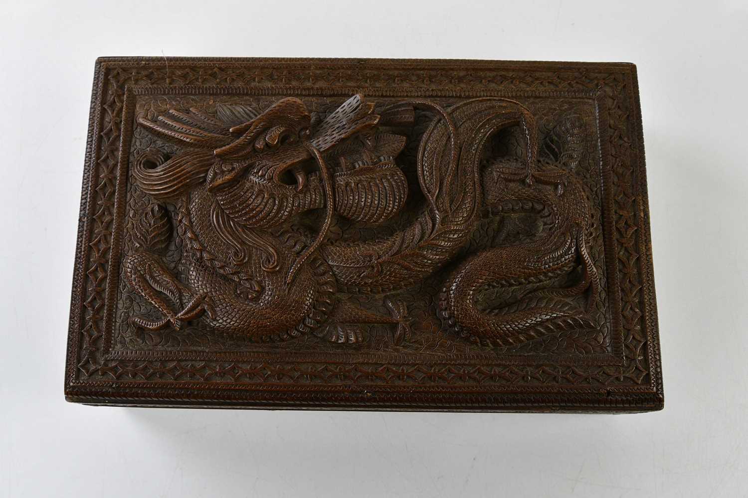 A Chinese hardwood carved box with stylised dragon in relief, height 8cm, width 28cm, depth 18cm. - Bild 2 aus 4
