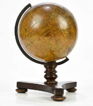 GEORGE WOODWARD; a 19th century 7inch celestial globe on tripod base, overall height 30cm.