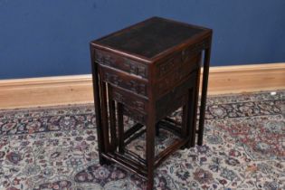 A nest of four Chinese carved hardwood tables, height 71cm, width 50cm, depth 46cm. Condition