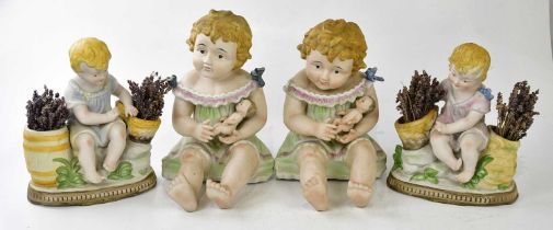 An identical pair of Continental painted bisque porcelain figures of seated child clutching a