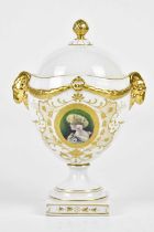 B BLOCH & CO (EICHWALD PORCELAIN); a late 19th/early 20th century pedestal urn and cover, with ram