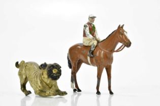 An Austrian cold painted bronze model of a pug, length 8cm, with a Britains horse and jockey (3)