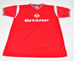 MANCHESTER UNITED; a score draw official retro football shirt signed by Norman Whiteside, sold