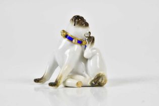 MEISSEN; a late 19th century model of a seated pug, height 5.5cm. Condition Report: Sadly missing