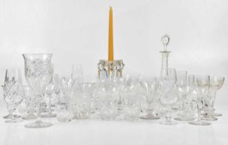 A large quantity of cut glass to include wine glasses, tumblers, a pair of decanters, bowls, jugs,