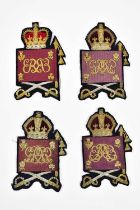 A collection of four Grenadier Guards Colour Sergeant arm badges, including George V, Edward VII,