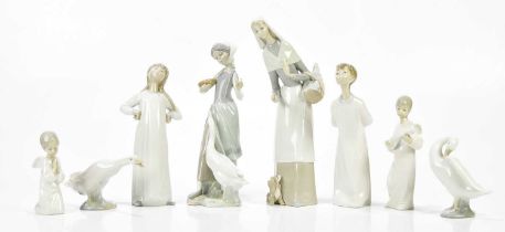 LLADRO; a collection of six ceramic figures and models including a girl holding a basket of bread