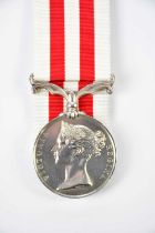 An Indian Mutiny Medal with no bars, issued to Quartermaster Sergeant G.B. Freeman, 87th Regiment.