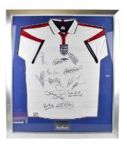 ENGLAND; a signed 2003/2004 football shirt, bearing fourteen signatures, framed and glazed.