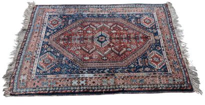 An Eastern style blue ground rug, with central elephant foot pattern, 155 x 112cm.