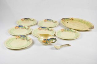CLARICE CLIFF; a fish service, comprising platter, six plates, sauce jug and spoon (9)