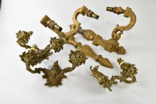 A pair of brass twin branch wall lights, together with a pair of gilt wood wall sconces, height