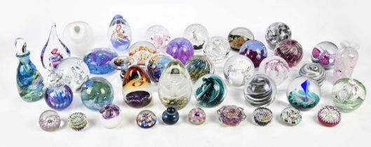 An extensive collection of contemporary glass paperweights including Caithness, Adrian Sankey, etc.