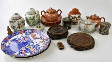 A large collection of Chinese and Oriental items to include ginger jars, teapots, hardwood stands,